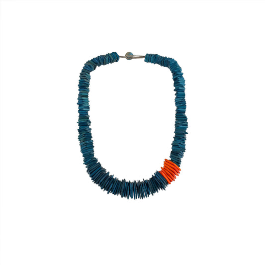 A handmade, sustainable wooden necklace featuring stacked wooden square components with visible natural grain and orange accent. The contemporary, modern design showcases eco-friendly craftsmanship and minimalist style.