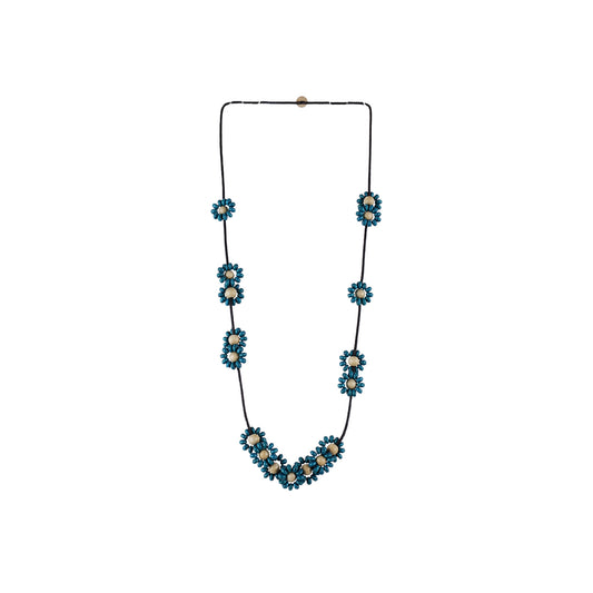 Handmade wooden necklace featuring mixed floral components in navy blue. An eco-friendly, artisan-crafted accessory inspired by nature, made from sustainable wood.